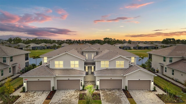 view of front of property with a water view