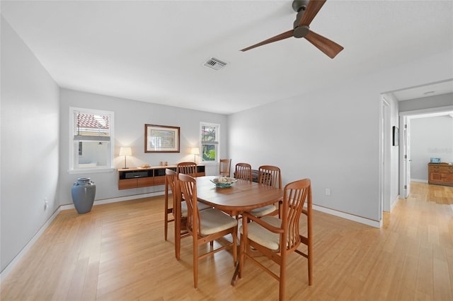 dining area featuring ceiling fan and light hardwood / wood-style floors