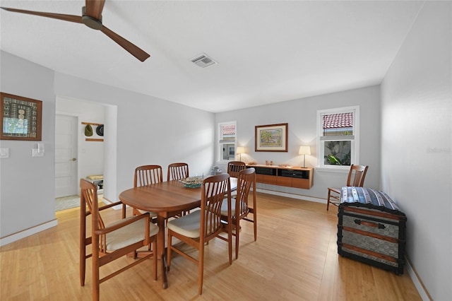 dining space featuring light hardwood / wood-style floors and ceiling fan