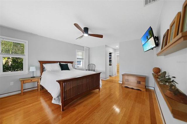 bedroom with ceiling fan and light hardwood / wood-style flooring