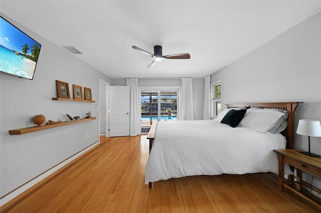 bedroom featuring access to exterior, ceiling fan, and light hardwood / wood-style floors