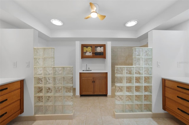 bathroom with vanity, tile patterned floors, and walk in shower