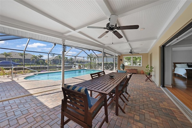 view of pool featuring a patio, a lanai, and ceiling fan