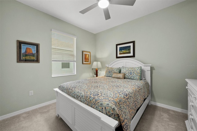 bedroom with light carpet and ceiling fan