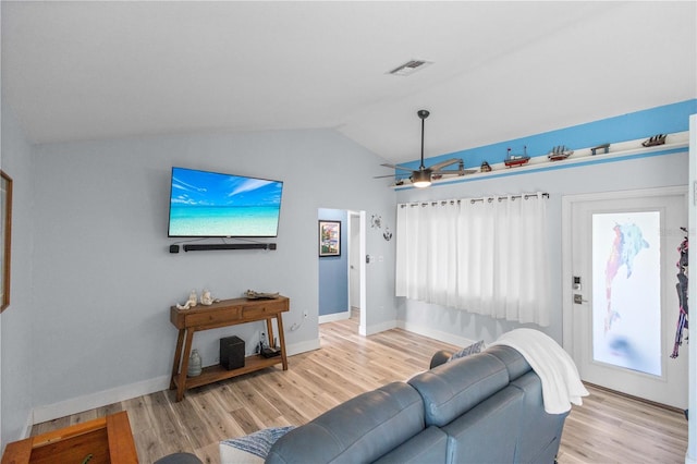 living room with vaulted ceiling, light hardwood / wood-style floors, and ceiling fan