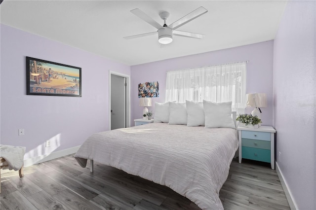 bedroom featuring hardwood / wood-style floors and ceiling fan