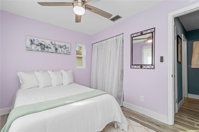 bedroom featuring light hardwood / wood-style floors and ceiling fan