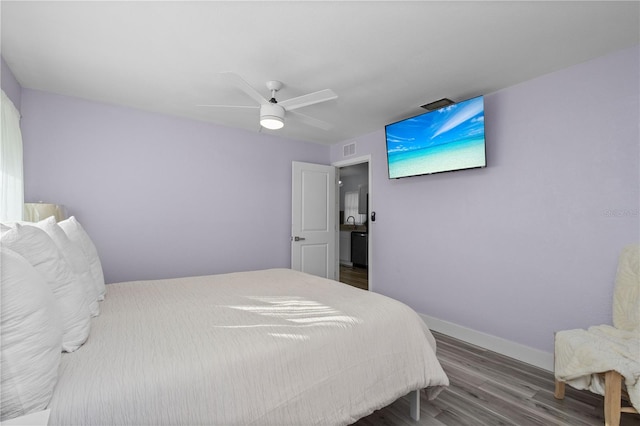 bedroom with dark wood-type flooring and ceiling fan