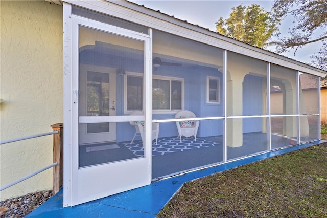 view of side of home featuring a sunroom