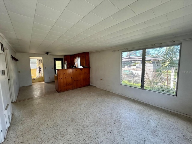 unfurnished living room featuring a wealth of natural light