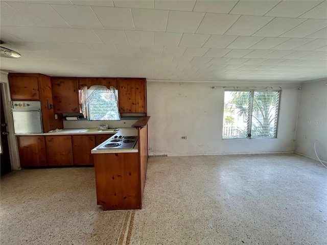 kitchen featuring wall oven, electric stovetop, and sink