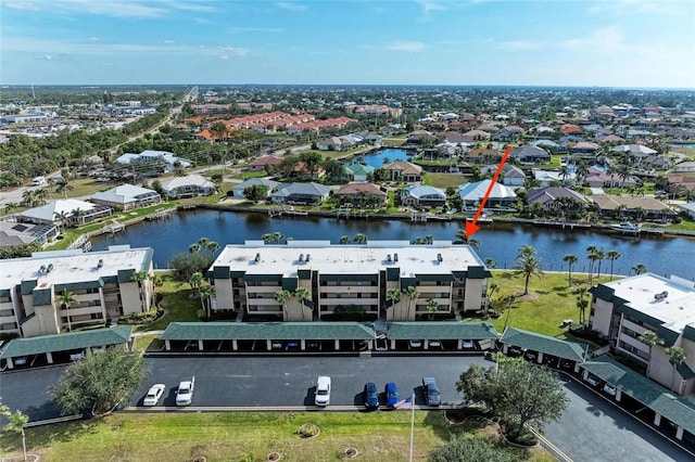 birds eye view of property featuring a water view