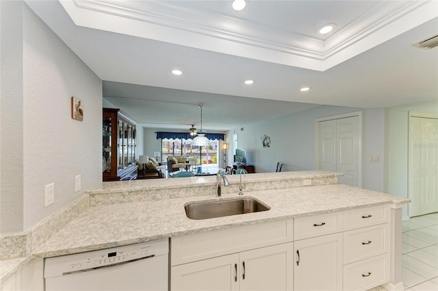 kitchen with sink, white cabinetry, white dishwasher, light stone counters, and kitchen peninsula