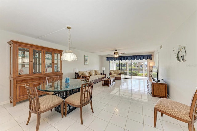 dining area featuring light tile patterned flooring and ceiling fan