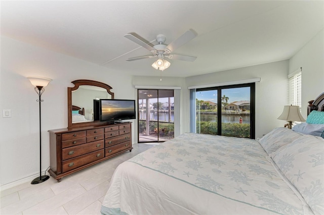 bedroom featuring ceiling fan and access to exterior