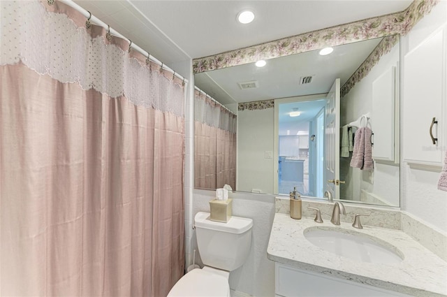 bathroom with vanity and toilet