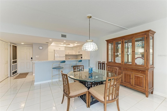 dining area featuring light tile patterned floors