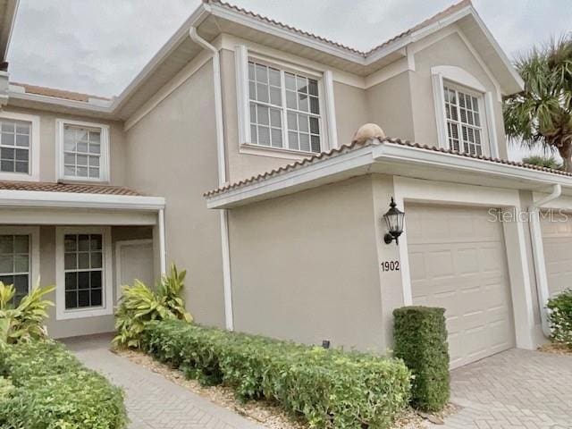 view of side of home featuring a garage