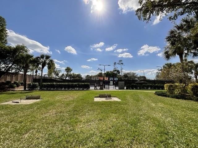 view of home's community featuring a yard