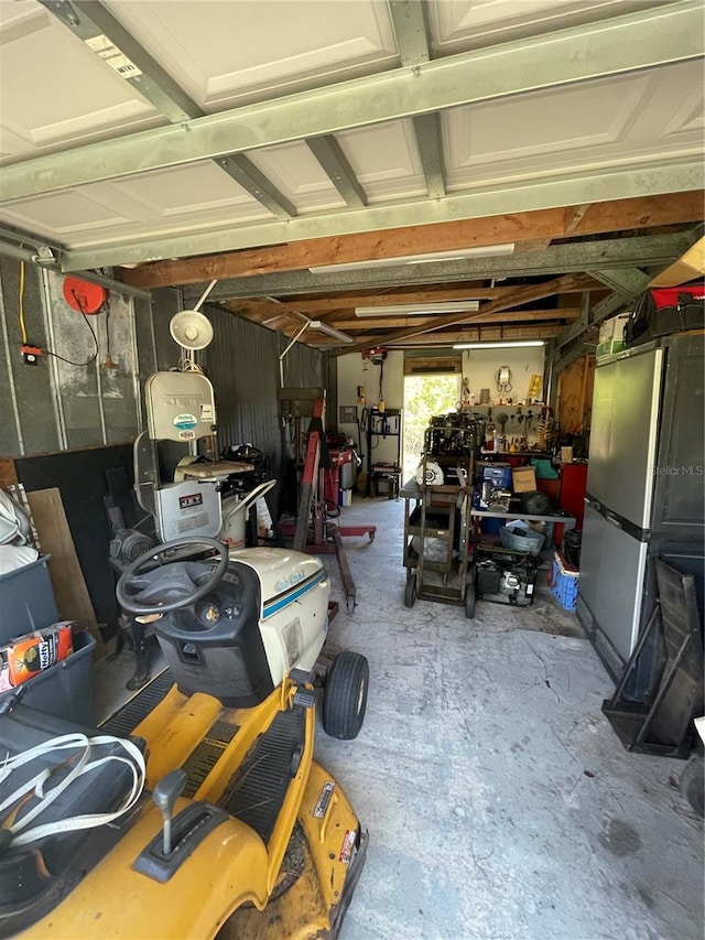 garage featuring stainless steel refrigerator