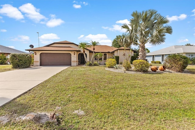 ranch-style house with a garage and a front lawn