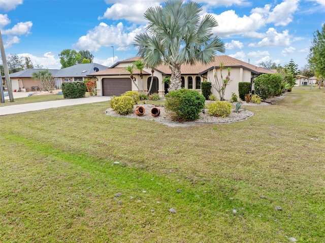 view of front of house with a garage and a front lawn