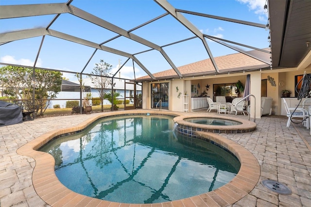 view of pool with a grill, a lanai, a patio, and an in ground hot tub