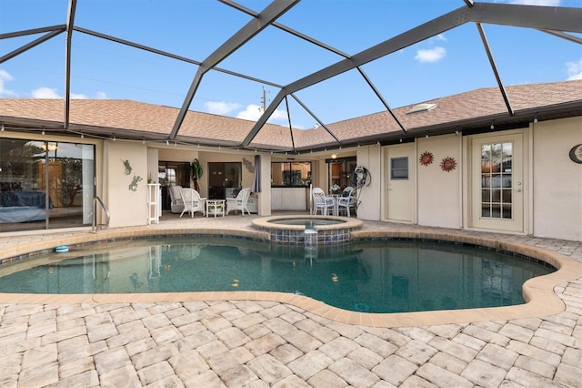 view of swimming pool featuring a lanai, a patio, and an in ground hot tub