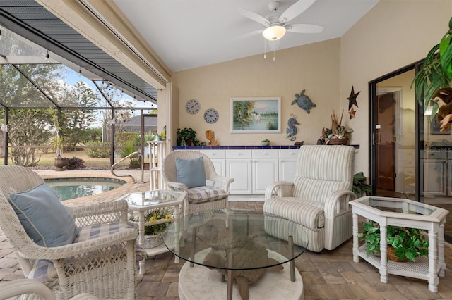 interior space featuring a pool, ceiling fan, and glass enclosure