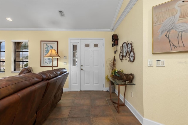 entryway featuring crown molding