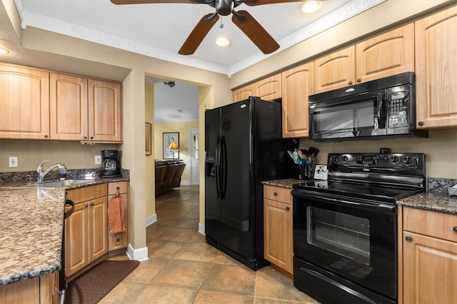 kitchen with sink, light brown cabinets, ornamental molding, dark stone counters, and black appliances