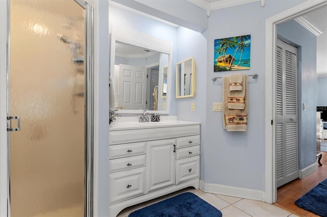 bathroom featuring walk in shower, tile patterned floors, ornamental molding, and vanity