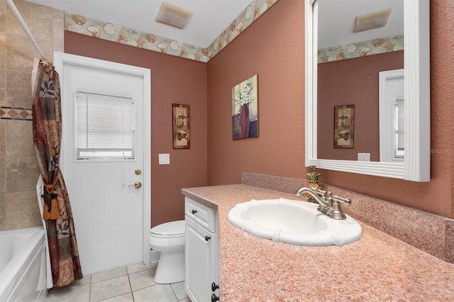 full bathroom featuring vanity, shower / bathtub combination with curtain, tile patterned floors, and toilet