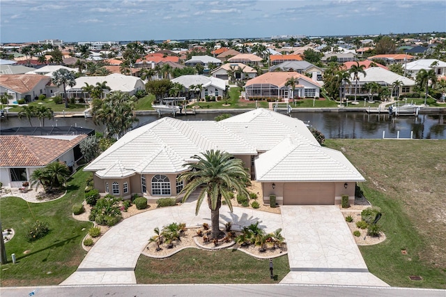 birds eye view of property with a water view