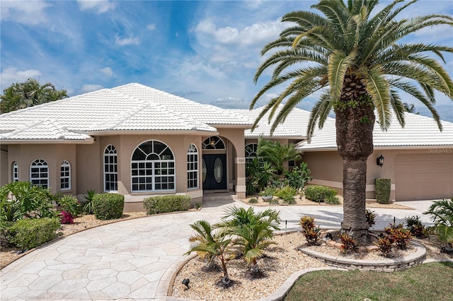 mediterranean / spanish-style house featuring a garage