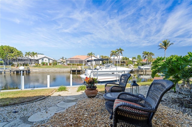 view of patio / terrace featuring a dock and a water view