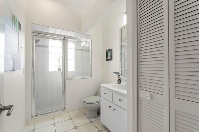 bathroom with vanity, a shower with shower door, and toilet