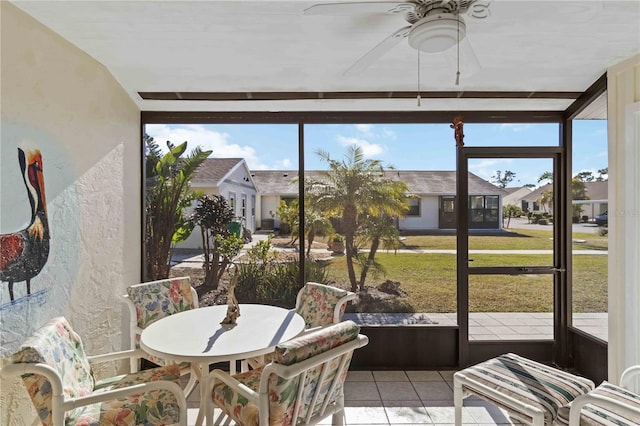 sunroom / solarium with ceiling fan