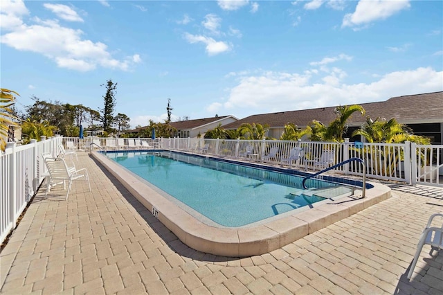 view of swimming pool with a patio