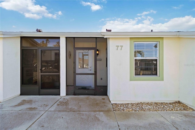 property entrance with a patio area