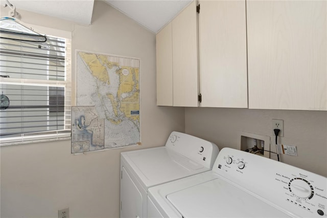 laundry room featuring cabinets and washing machine and clothes dryer