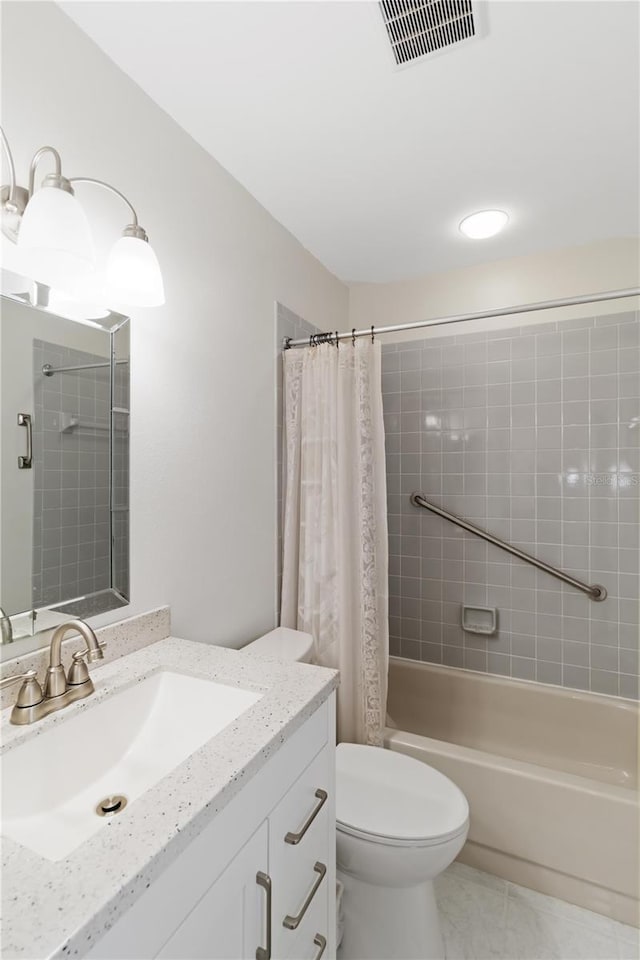 full bathroom with vanity, shower / bath combination with curtain, tile patterned floors, and toilet