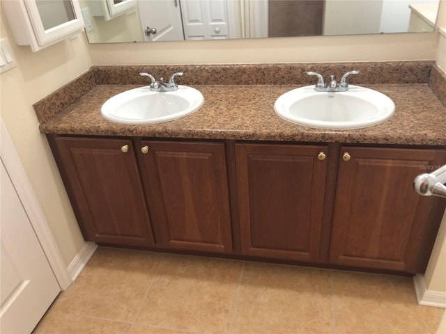 bathroom with vanity and tile patterned flooring