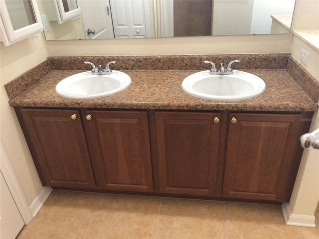 bathroom with vanity and tile patterned flooring