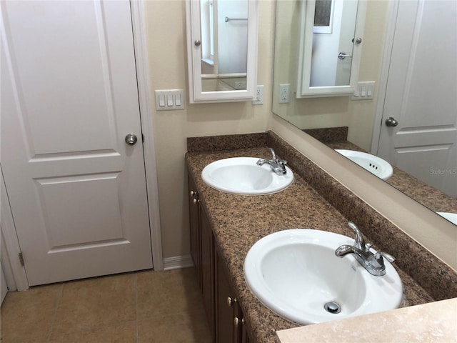 bathroom with vanity and tile patterned floors