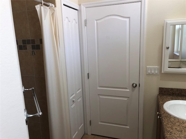 bathroom with vanity and a shower with shower curtain