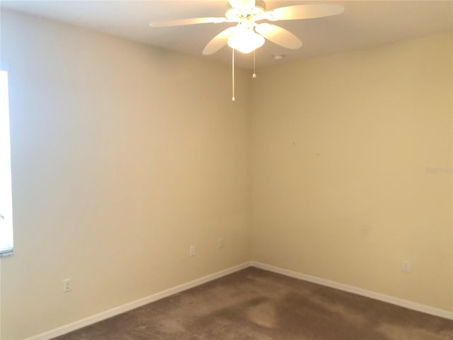 carpeted empty room featuring ceiling fan