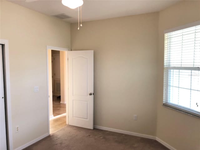 unfurnished bedroom with carpet floors