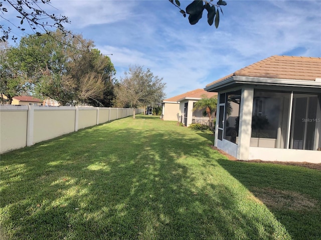 view of yard with a sunroom