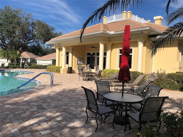 exterior space featuring ceiling fan and a patio area